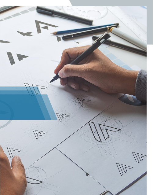 Designer sketching brand logo concepts on paper