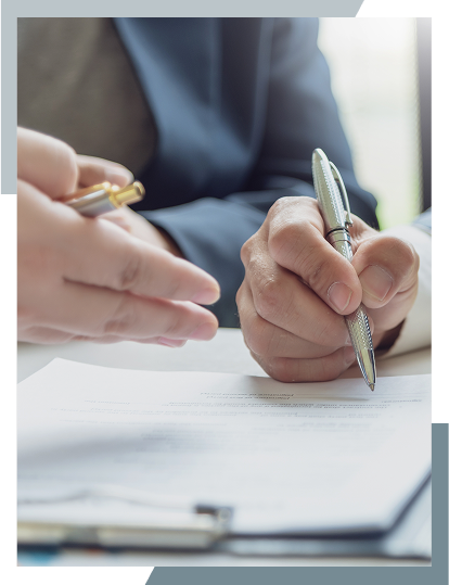 Professionals signing intellectual property documents