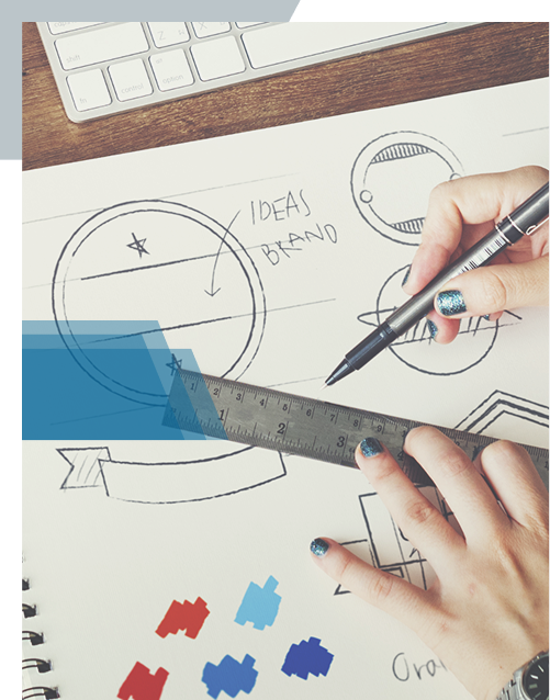 Designer sketching logo concepts with colour swatches