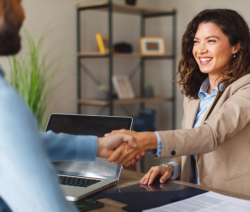 Client shaking hands with an IP consultant in an office