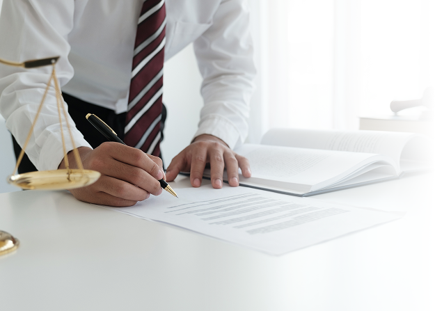 Business professional signing registration papers