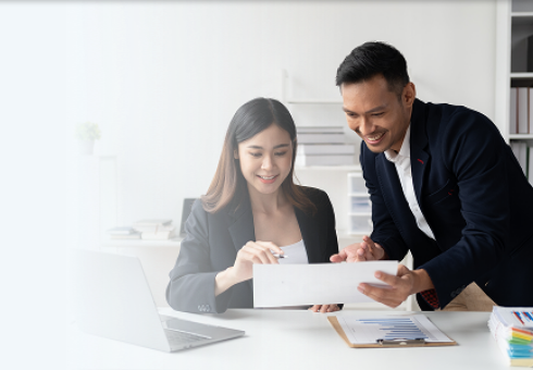 Business professionals reviewing case study documents together