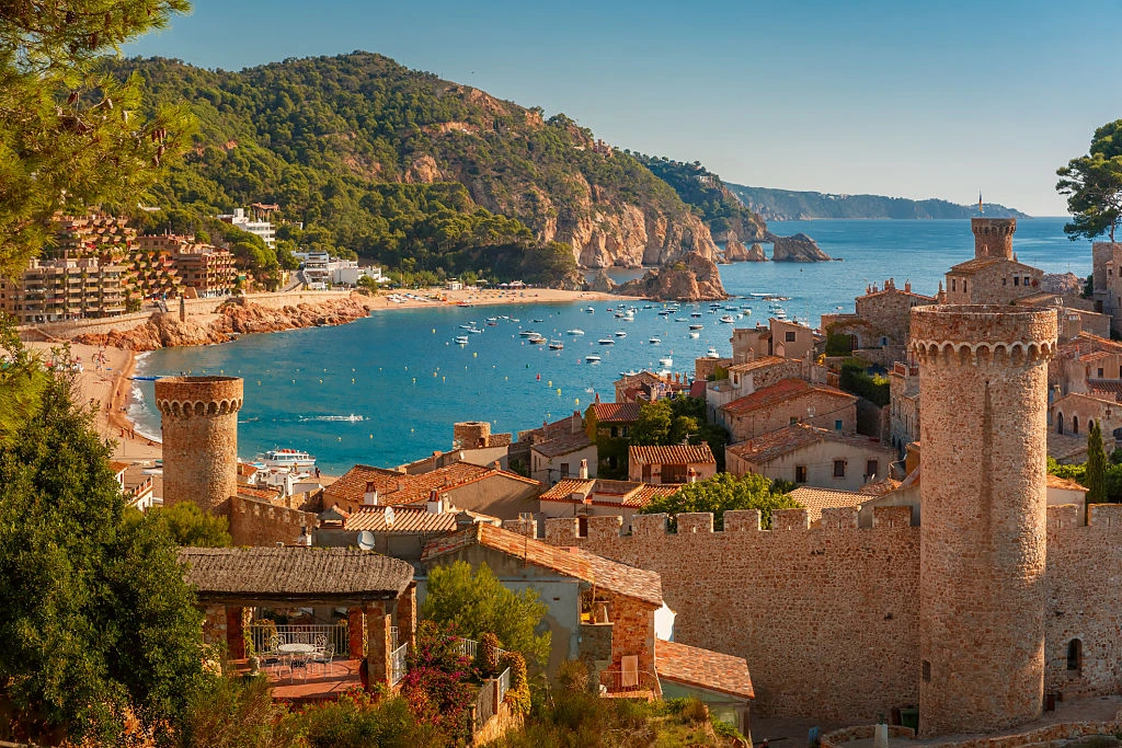 Spanish coastal town with historic castle tower – Trademark registration in Spain